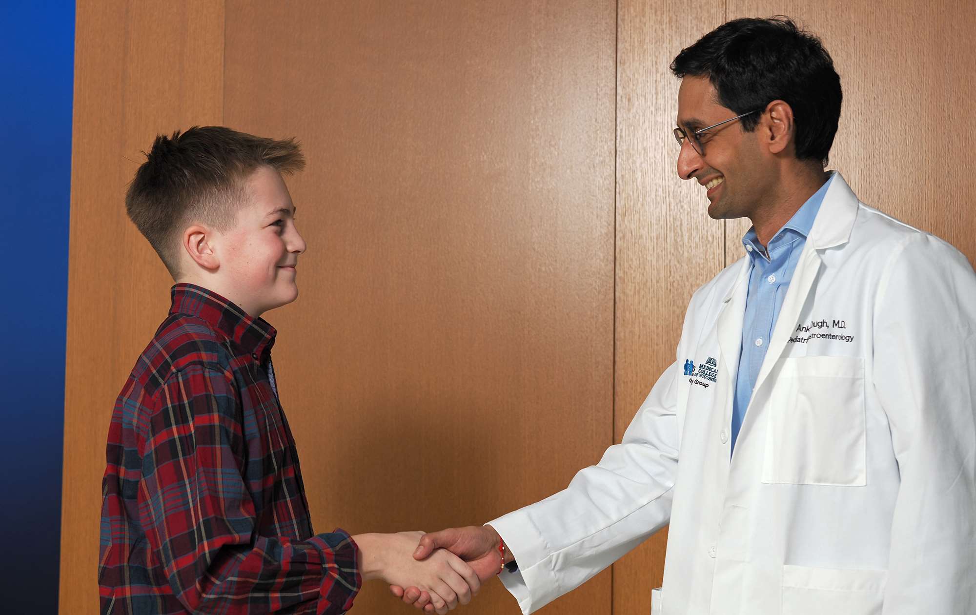 Auggie is back in the game (pictured with Dr. Ankur Chugh)